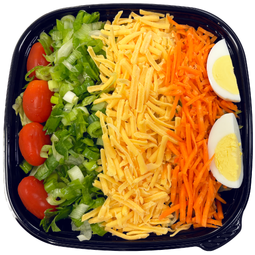 Salad tray with lettuce, tomatoes, green onions, cheese, carrots, and eggs