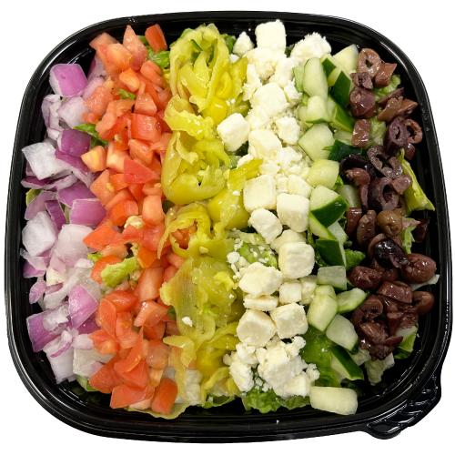 Salad tray with lettuce, onions, tomatoes, peppers, cheese, cucumbers and olives