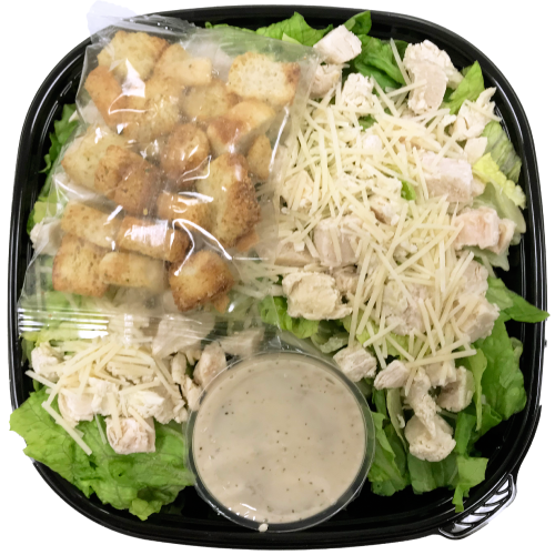 Salad tray with lettuce, chicken, croutons and dressing